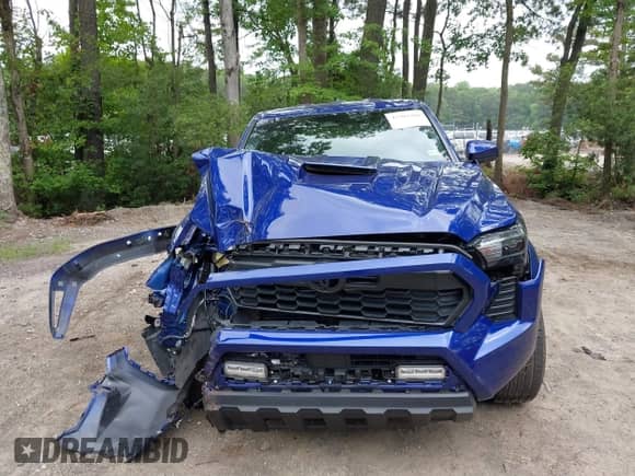 2024 Toyota Tacoma SR5 z VIN 3TMLB5JN5RM079724, wystawiony jako IAAI lot #42507488 z przebiegiem 6 543 mil mil oraz . Historia ofert i sprzedaży dostępna na DreamBid. Obrazek 12.