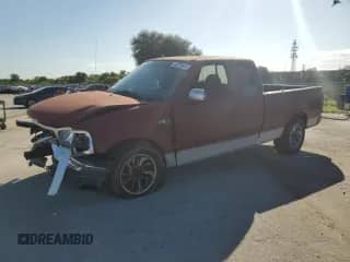 1999 Ford F-150 с VIN 1FTZX1722XNA30792, выставлен на аукционе Copart как лот 80275685 с пробегом Не указан миль и Списание • Salvage title. История ставок и продаж доступна на DreamBid. Изображение 1.