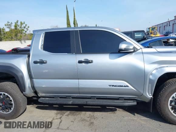 2024 Toyota Tacoma SR5 with VIN 3TMLB5JN6RM022612, listed as a IAAI auction lot 41611378 with 7,275 mi miles and . Bid and sale history available at DreamBid. Image 14.