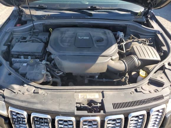 2018 Jeep Grand Cherokee Overland with VIN 1C4RJFCG5JC263987, listed as a Copart auction lot 81916125 with 87,504 mi miles and Salvage title. Bid and sale history available at DreamBid. Image 12.