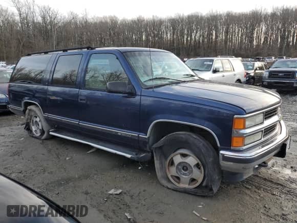 1997 Chevrolet Suburban with VIN 3GNFK16R6VG120489, listed as a Copart auction lot 44324705 with 218,764 mi miles and Salvage title. Bid and sale history available at DreamBid. Image 4.