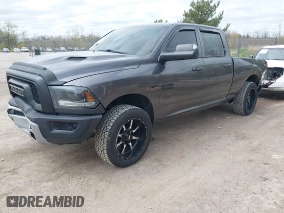 2015 Ram 1500 Sport with VIN 1C6RR7UTXFS736295, listed as a IAAI auction lot 42184233 with 119,600 mi miles and . Bid and sale history available at DreamBid. Image 2.