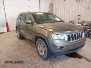 2012 Jeep Grand Cherokee Laredo with VIN 1C4RJFAG3CC214762, listed as a IAAI auction lot 43153932 with 257,360 mi miles and . Bid and sale history available at DreamBid. Image 1.