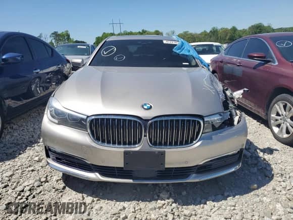 2017 BMW 7 Series 740i xDrive with VIN WBA7E4C58HGU99595, listed as a Copart auction lot 47221875 with 107,419 mi miles and Salvage title. Bid and sale history available at DreamBid. Image 5.