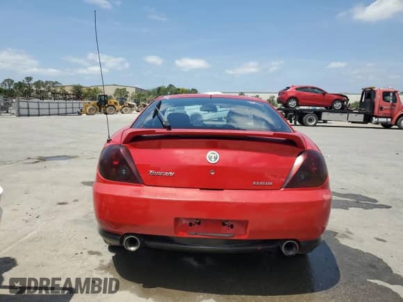 2003 Hyundai Tiburon GT с VIN KMHHN65F33U088538, выставлен на аукционе Copart как лот 54320955 с пробегом 220 732 миль миль и Списание • Salvage title. История ставок и продаж доступна на DreamBid. Изображение 6.