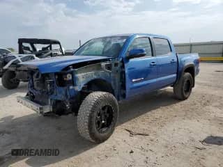 2017 Toyota Tacoma SR5 with VIN 3TMCZ5ANXHM103073, listed as a Copart auction lot 69403705 with 124,654 mi miles and Salvage title. Bid and sale history available at DreamBid. Image 1.