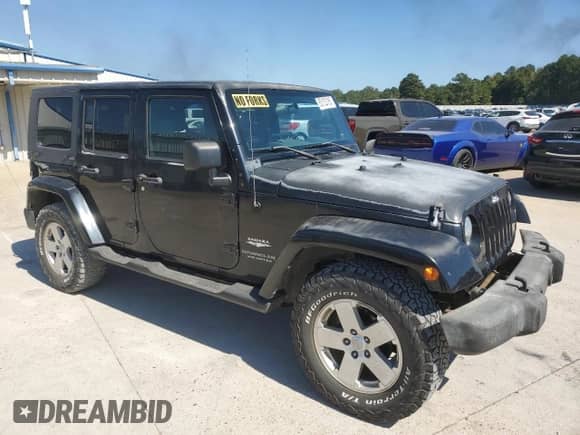 2007 Jeep Wrangler Unlimited Sahara z VIN 1J4GA59127L152918, wystawiony jako Copart lot #85123165 z przebiegiem 180 573 mil mil oraz Szkoda całkowita • Salvage title. Historia ofert i sprzedaży dostępna na DreamBid. Obrazek 4.