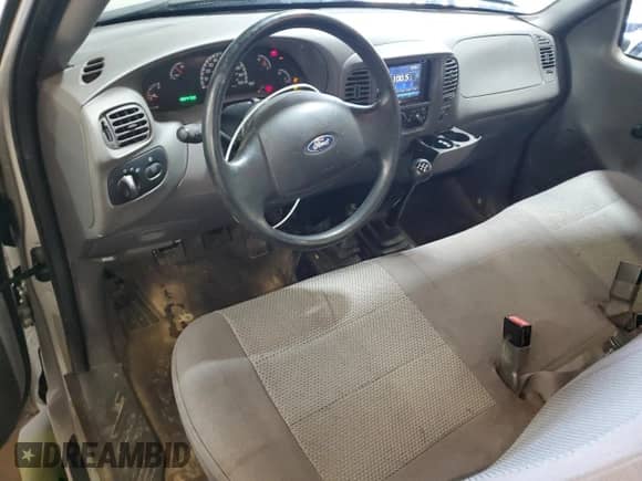 2003 Ford F-150 XL with VIN 1FTRF18203NA89724, listed as a Copart auction lot 68642125 with 102,470 mi miles and Clean title. Bid and sale history available at DreamBid. Image 8.