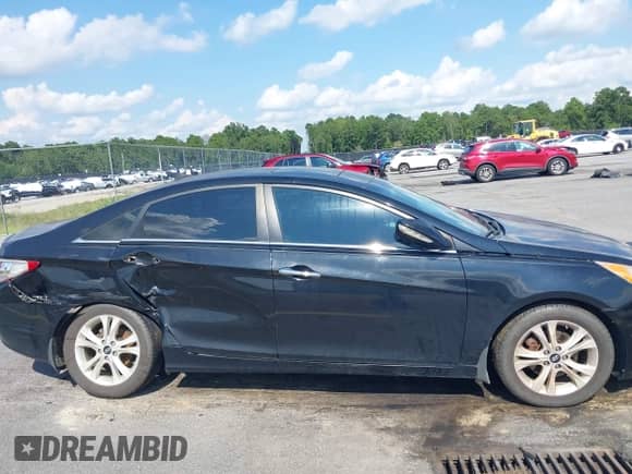 2013 Hyundai Sonata Limited z VIN 5NPEC4AC5DH675946, wystawiony jako IAAI lot #43042846 z przebiegiem 166 357 mil mil oraz . Historia ofert i sprzedaży dostępna na DreamBid. Obrazek 13.