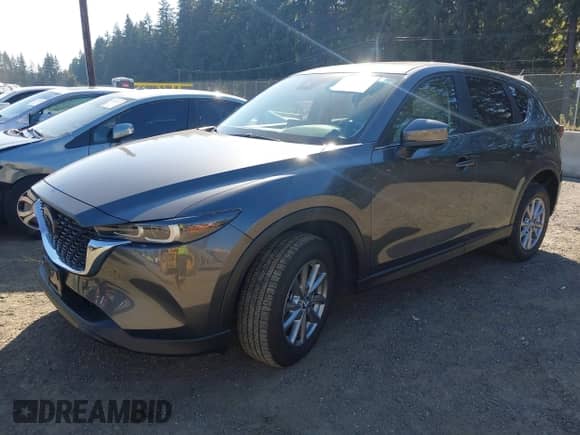 2023 Mazda CX-5 S Carbon Edition z VIN JM3KFBCM6P0143148, wystawiony jako IAAI lot #43382486 z przebiegiem 22 099 mil mil oraz . Historia ofert i sprzedaży dostępna na DreamBid. Obrazek 2.