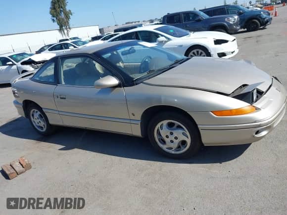1996 Saturn 2dr Coupe with VIN 1G8ZH1271TZ371582, listed as a IAAI auction lot 42385058 with 152,207 mi miles and . Bid and sale history available at DreamBid. Image 13.