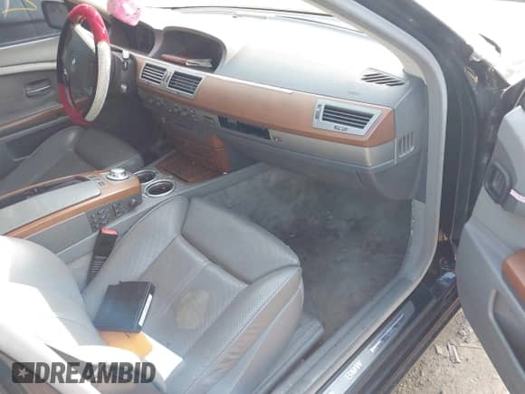 2003 BMW 7 Series 745i z VIN WBAGL63483DP67483, wystawiony jako IAAI lot #42427241 z przebiegiem Nie podano mil oraz . Historia ofert i sprzedaży dostępna na DreamBid. Obrazek 5.