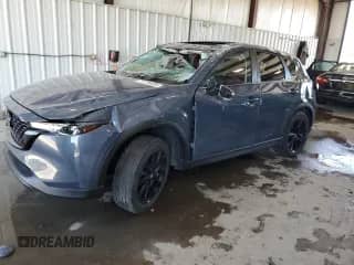 2022 Mazda CX-5 S Carbon Edition z VIN JM3KFBCM3N0639523, wystawiony jako Copart lot #71176405 z przebiegiem 23 821 mil mil oraz Szkoda całkowita • Salvage title. Historia ofert i sprzedaży dostępna na DreamBid. Obrazek 1.
