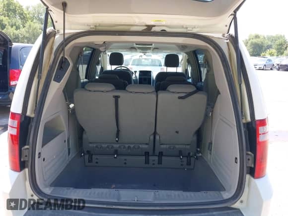 2009 Dodge Grand Caravan SXT with VIN 2D8HN54159R626944, listed as a IAAI auction lot 43056559 with 220,711 mi miles and . Bid and sale history available at DreamBid. Image 12.