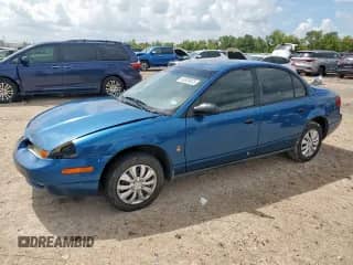 2002 Saturn SL z VIN 1G8ZF52812Z229544, wystawiony jako Copart lot #83826835 z przebiegiem 214 162 mil mil oraz Szkoda całkowita • Salvage title. Historia ofert i sprzedaży dostępna na DreamBid. Obrazek 1.