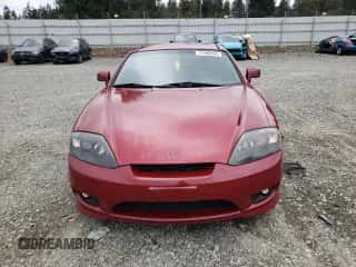2006 Hyundai Tiburon GT с VIN KMHHN65FX6U228735, выставлен на аукционе Copart как лот 71986204 с пробегом 179 943 миль миль и Списание • Salvage title. История ставок и продаж доступна на DreamBid. Изображение 5.