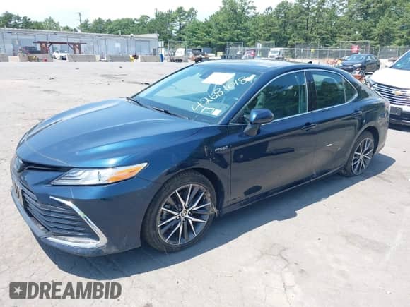 2021 Toyota Camry Hybrid XLE with VIN 4T1F31AK3MU554067, listed as a IAAI auction lot 42681018 with 53,630 mi miles and . Bid and sale history available at DreamBid. Image 2.