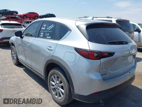 2022 Mazda CX-5 S Select z VIN JM3KFBBMXN0638208, wystawiony jako IAAI lot #43058565 z przebiegiem 34 039 mil mil oraz . Historia ofert i sprzedaży dostępna na DreamBid. Obrazek 3.