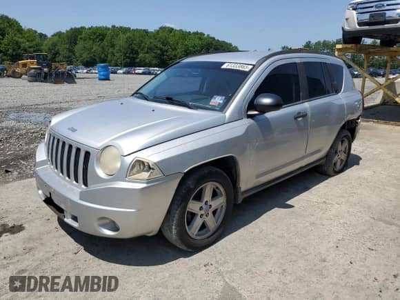2007 Jeep Compass Sport with VIN 1J8FT47W87D158424, listed as a Copart auction lot 61333865 with 243,861 mi miles and Salvage title. Bid and sale history available at DreamBid. Image 1.