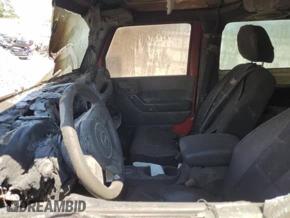 2012 Jeep Wrangler Sport z VIN 1C4AJWAGXCL219342, wystawiony jako Copart lot #71405885 z przebiegiem Nie podano mil oraz Nie do naprawy • Non repairable. Historia ofert i sprzedaży dostępna na DreamBid. Obrazek 7.