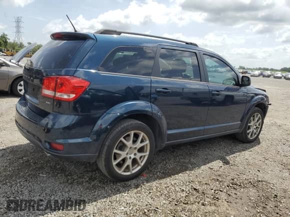 2014 Dodge Journey SXT with VIN 3C4PDCBG2ET217784, listed as a Copart auction lot 60124435 with 104,179 mi miles and Salvage title. Bid and sale history available at DreamBid. Image 3.