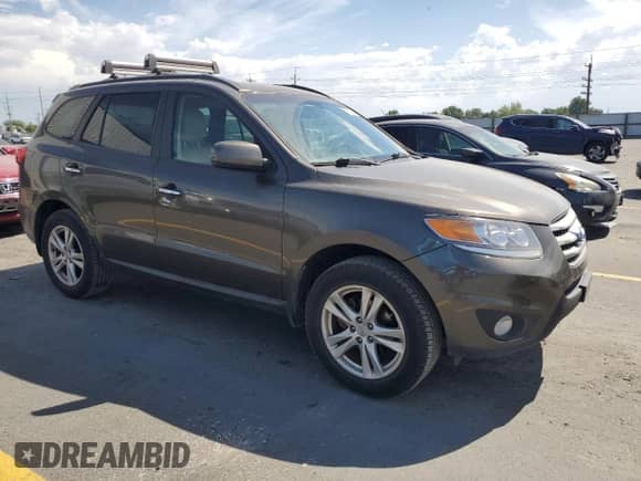 2012 Hyundai Santa Fe Limited z VIN 5XYZK4AG6CG153372, wystawiony jako Copart lot #61257275 z przebiegiem 157 016 mil mil oraz Szkoda całkowita • Salvage title. Historia ofert i sprzedaży dostępna na DreamBid. Obrazek 4.