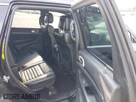 2018 Jeep Grand Cherokee Sterling with VIN 1C4RJFBT8JC326885, listed as a IAAI auction lot 43028769 with 124,755 mi miles and . Bid and sale history available at DreamBid. Image 8.