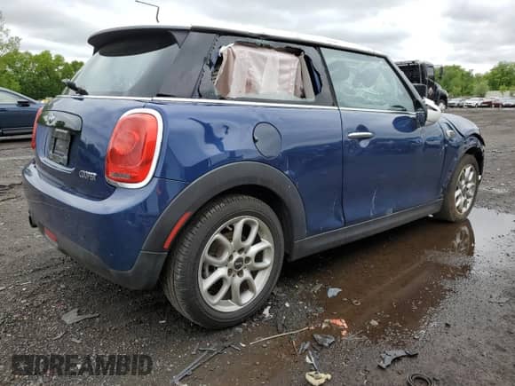 2016 MINI Hardtop with VIN WMWXP5C58G3B76219, listed as a Copart auction lot 57879225 with 94,245 mi miles and Salvage title. Bid and sale history available at DreamBid. Image 3.