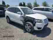 2010 Hyundai Santa Fe Limited with VIN 5NMSKDAG1AH358201, listed as a Copart auction lot 64977195 with 112,583 mi miles and Salvage title. Bid and sale history available at DreamBid. Image 4.