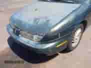 1999 Saturn SL z VIN 1G8ZK5274XZ351289, wystawiony jako IAAI lot #41734679 z przebiegiem 140 006 mil mil oraz . Historia ofert i sprzedaży dostępna na DreamBid. Obrazek 6.