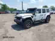 2021 Jeep Wrangler Unlimited Rubicon with VIN 1C4HJXFN0MW648257, listed as a IAAI auction lot 42594545 with 49,410 mi miles and . Bid and sale history available at DreamBid. Image 2.