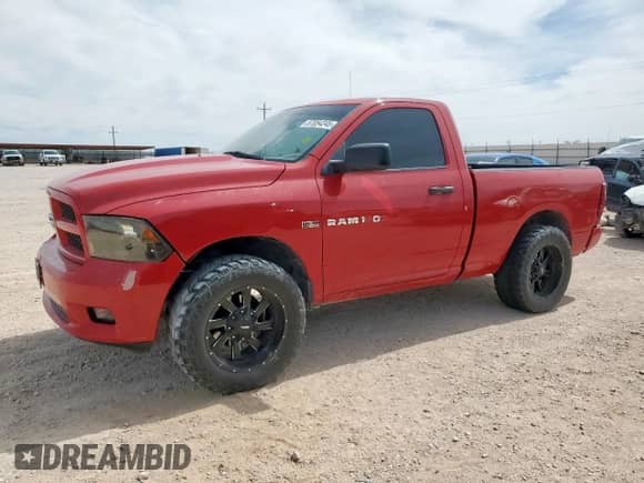 2012 Ram 1500 Express with VIN 3C6JD7AT6CG278287, listed as a Copart auction lot 57054245 with 114,229 mi miles and Salvage title. Bid and sale history available at DreamBid. Image 1.