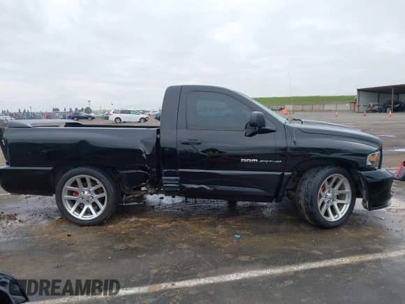 2004 Dodge RAM with VIN 3D3HA16H34G269900, listed as a IAAI auction lot 41715461 with 70,182 mi miles and . Bid and sale history available at DreamBid. Image 14.