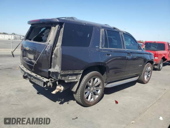 2015 Chevrolet Tahoe LTZ with VIN 1GNSCCKC0FR643825, listed as a Copart auction lot 81731565 with 194,892 mi miles and Salvage title. Bid and sale history available at DreamBid. Image 3.