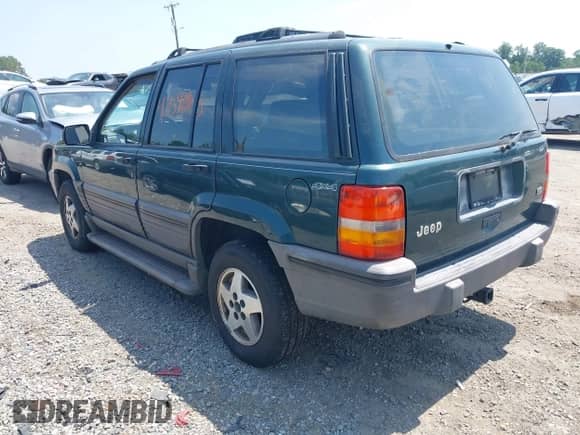 1994 Jeep Grand Cherokee Laredo with VIN 1J4GZ58Y5RC145018, listed as a IAAI auction lot 42590945 with 266,020 mi miles and . Bid and sale history available at DreamBid. Image 3.
