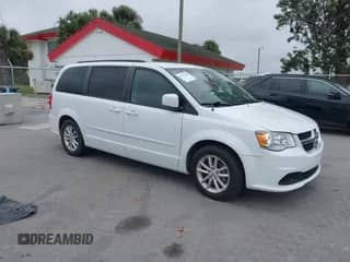 2014 Dodge Grand Caravan SXT 30th Anniversary with VIN 2C4RDGCG0ER254057, listed as a IAAI auction lot 40737960 with 142,301 mi miles and . Bid and sale history available at DreamBid. Image 1.