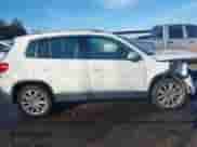 2014 Volkswagen Tiguan SEL with VIN WVGAV3AX8EW538318, listed as a IAAI auction lot 41277703 with 130,827 mi miles and . Bid and sale history available at DreamBid. Image 13.