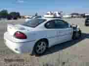 1999 Pontiac Grand Am GT z VIN 1G2NW12EXXM754842, wystawiony jako Copart lot #46940335 z przebiegiem 124 886 mil mil oraz Szkoda całkowita • Salvage title. Historia ofert i sprzedaży dostępna na DreamBid. Obrazek 3.