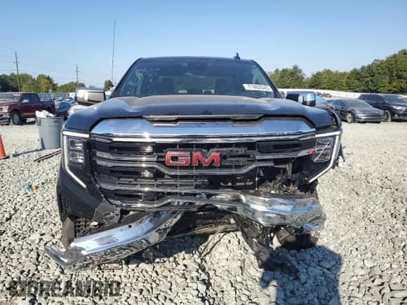 2023 GMC Sierra 1500 SLT with VIN 3GTUUDED0PG169885, listed as a Copart auction lot 71402045 with 57,205 mi miles and Salvage title. Bid and sale history available at DreamBid. Image 5.