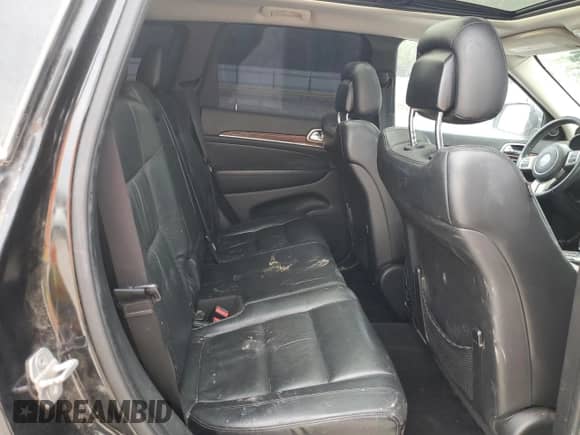 2013 Jeep Grand Cherokee Limited z VIN 1C4RJEBG4DC636503, wystawiony jako Copart lot #89665075 z przebiegiem 143 877 mil mil oraz Czysty tytuł • Clean title. Historia ofert i sprzedaży dostępna na DreamBid. Obrazek 10.