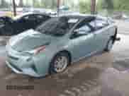 2016 Toyota Prius Four z VIN JTDKARFU9G3024875, wystawiony jako IAAI lot #42314235 z przebiegiem 101 383 mil mil oraz . Historia ofert i sprzedaży dostępna na DreamBid. Obrazek 2.