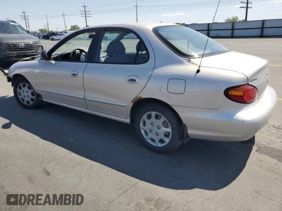 1999 Hyundai Elantra GL z VIN KMHJF25F4XU842009, wystawiony jako Copart lot #60836875 z przebiegiem 190 248 mil mil oraz Szkoda całkowita • Salvage title. Historia ofert i sprzedaży dostępna na DreamBid. Obrazek 2.
