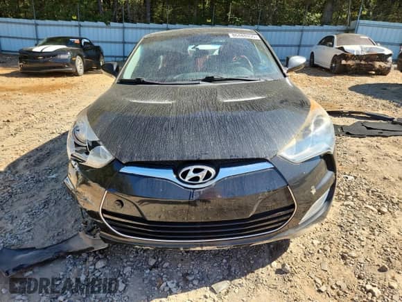 2012 Hyundai Veloster w/Black Int z VIN KMHTC6AD4CU032645, wystawiony jako Copart lot #86488855 z przebiegiem 90 307 mil mil oraz Szkoda całkowita • Salvage title. Historia ofert i sprzedaży dostępna na DreamBid. Obrazek 5.