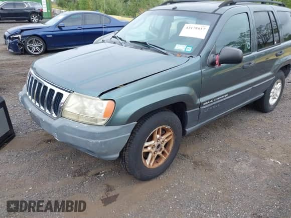 2003 Jeep Grand Cherokee Laredo with VIN 1J4GW48S23C610697, listed as a IAAI auction lot 43178617 with 227,331 mi miles and . Bid and sale history available at DreamBid. Image 4.