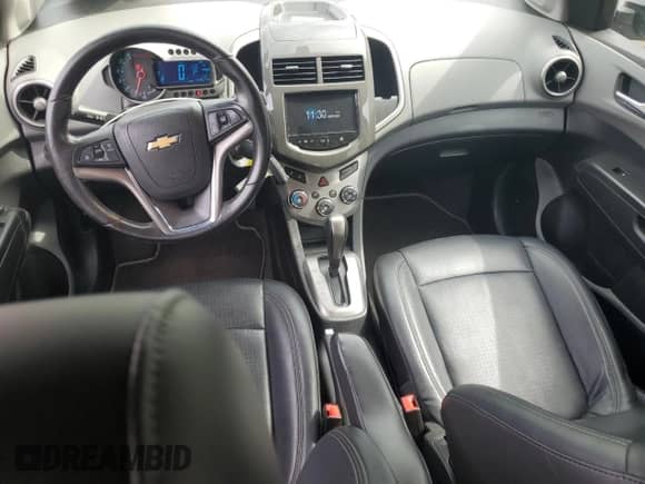 2014 Chevrolet Sonic LTZ с VIN 1G1JE6SB5E4131294, выставлен на аукционе Copart как лот 80164615 с пробегом 69 644 миль миль и Списание • Salvage title. История ставок и продаж доступна на DreamBid. Изображение 8.