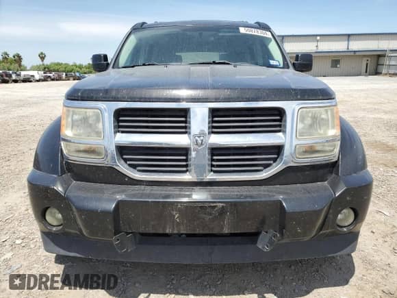 2009 Dodge Nitro SXT с VIN 1D8GU28KX9W542982, выставлен на аукционе Copart как лот 50878304 с пробегом 137 893 миль миль и Списание • Salvage title. История ставок и продаж доступна на DreamBid. Изображение 5.