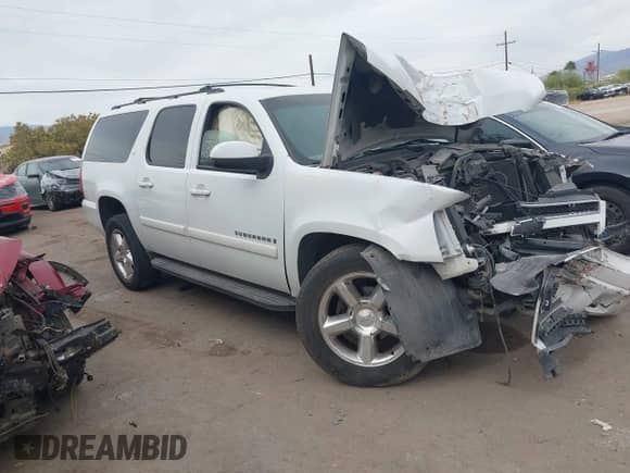2009 Chevrolet Suburban 1LT z VIN 1GNFC260X9J108211, wystawiony jako IAAI lot #42237663 z przebiegiem Nie podano mil oraz . Historia ofert i sprzedaży dostępna na DreamBid. Obrazek 1.