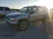 1999 Nissan Pathfinder XE with VIN JN8AR05Y4XW317915, listed as a Copart auction lot 82496174 with 301,862 mi miles and Salvage title. Bid and sale history available at DreamBid. Image 1.