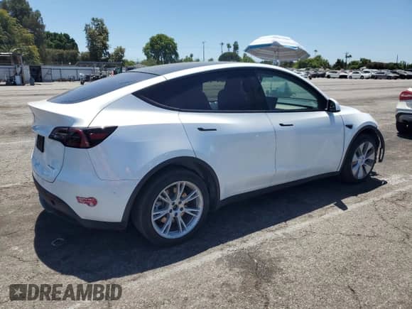 2023 Tesla Model Y Long Range with VIN 7SAYGDEEXPA039314, listed as a Copart auction lot 66657855 with 93,046 mi miles and Salvage title. Bid and sale history available at DreamBid. Image 3.