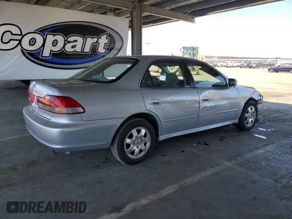 2002 Honda Accord EX с VIN 1HGCG56642A094478, выставлен на аукционе Copart как лот 70194195 с пробегом 208 583 миль миль и Списание • Salvage title. История ставок и продаж доступна на DreamBid. Изображение 3.